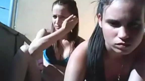 Two teen go topless on balcony